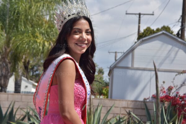 Young Woman Pageant Winner Wearing a Crown and Sash